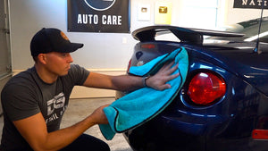 Mitch the detail geek in an auto detail shop with microfiber car drying towel